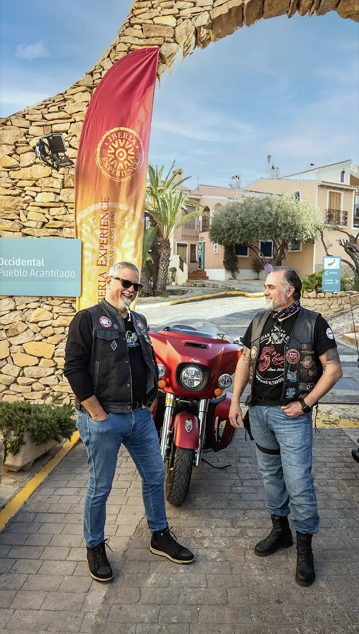 Two bikers of IMRG Alicante by main entrance of hotel Pueblo Acantilado