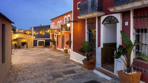 Evening street lighting at Hotel Occidental Pueblo Acantilado
